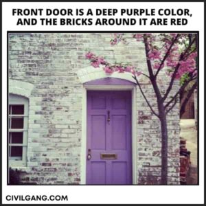 Front Door Is a Deep Purple Color, and the Bricks Around It Are Red